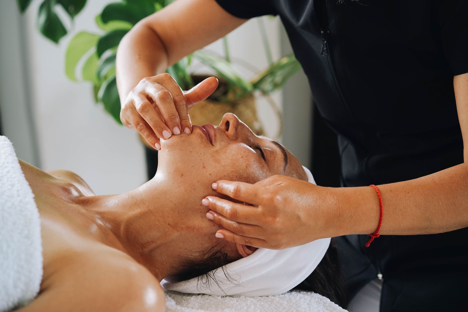Calming facial massage session, similar to buccal facial massage used for jaw tension and TMJ relief